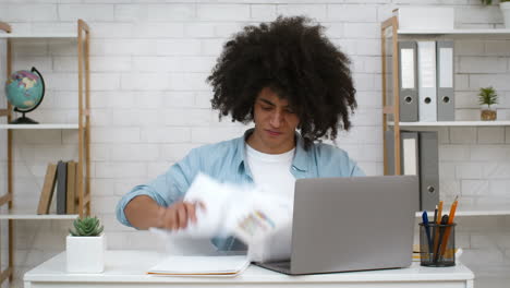 stressed young adult struggling with paperwork