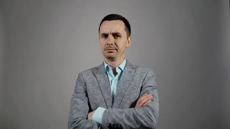 closeup portrait of young business man listens and disagrees shakes head