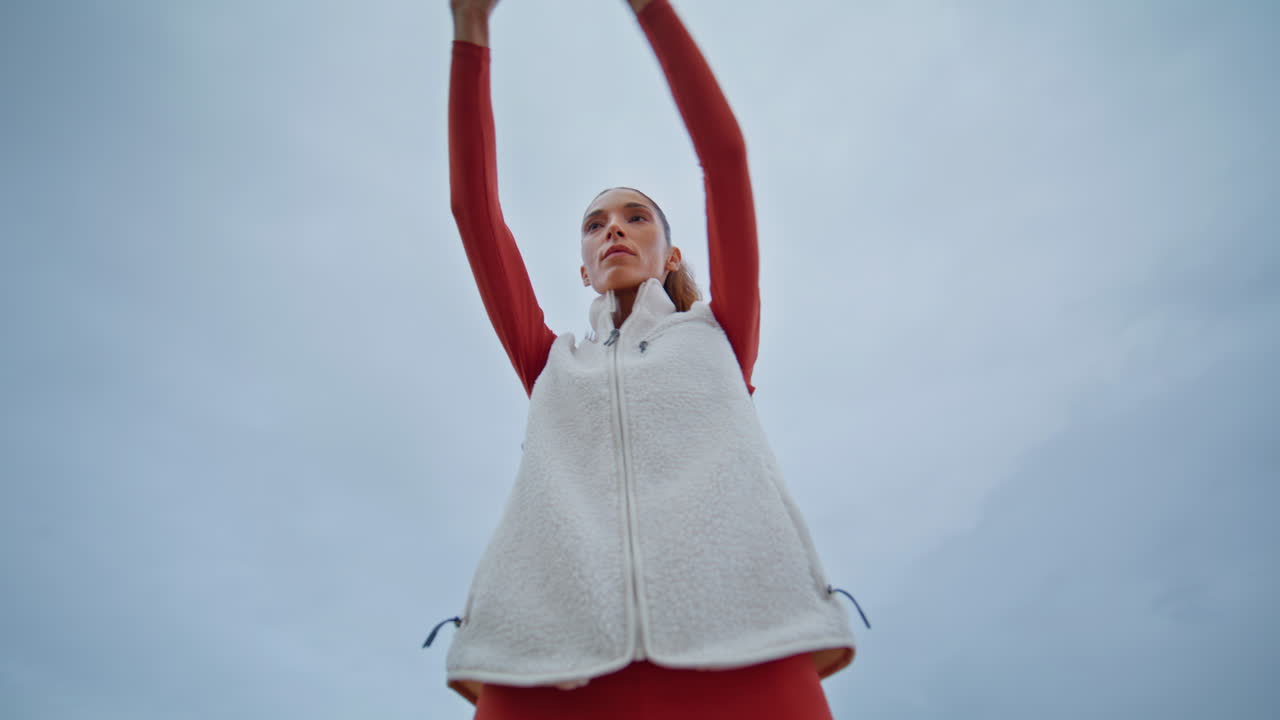 Sportswoman enjoy fitness training on cloudy nature closeup. Woman stretching