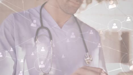 animación de una red de conexiones con iconos sobre un médico caucásico usando una tableta