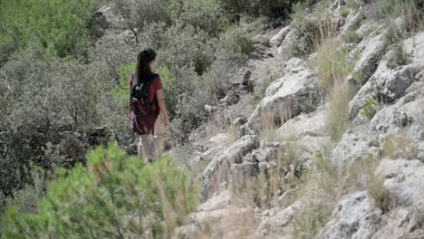 woman hiking on mountain trail
