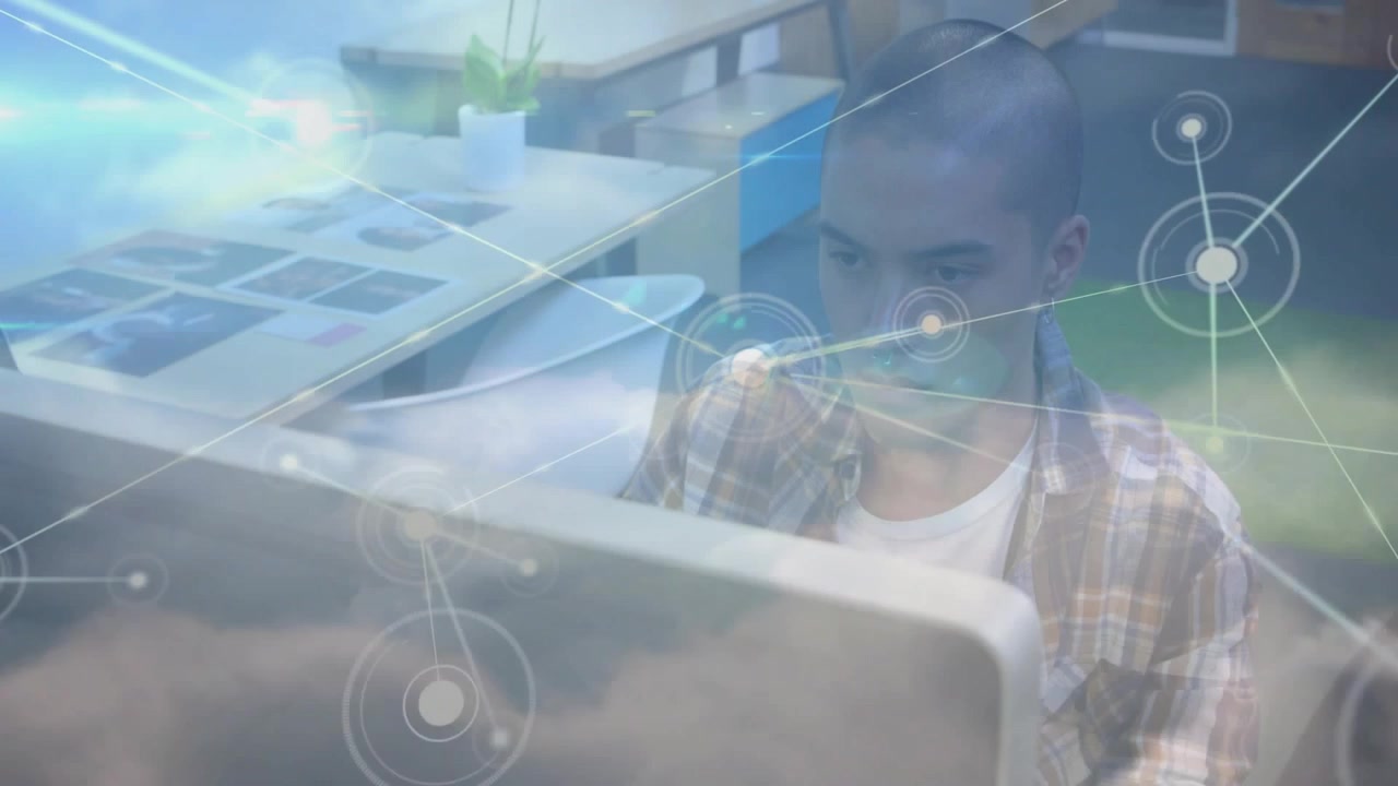 Vertical video: Clouds rising, nodes spreading across frame while man viewing monitor, showing data