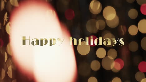 Animation-of-happy-holidays-text-over-yellow-spots-of-light-background