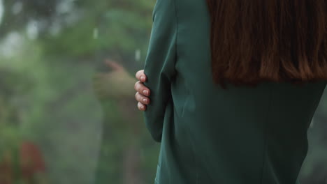 woman in green jacket