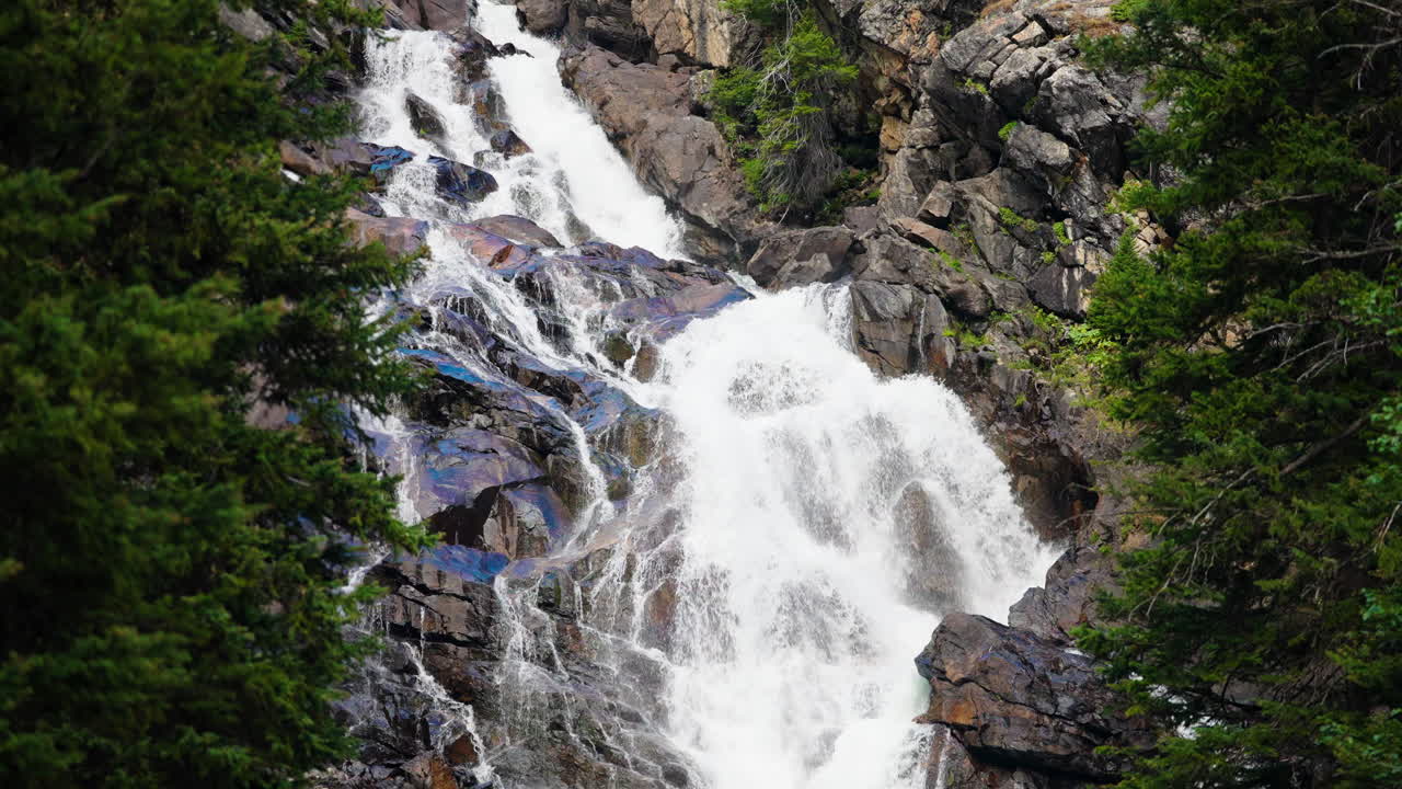 Majestic Waterfall Cascading Through Rocks and Trees