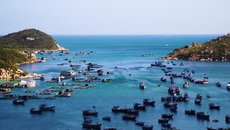 vinh hy bay, vietnam harbor panorama with fishing boats and fish farms