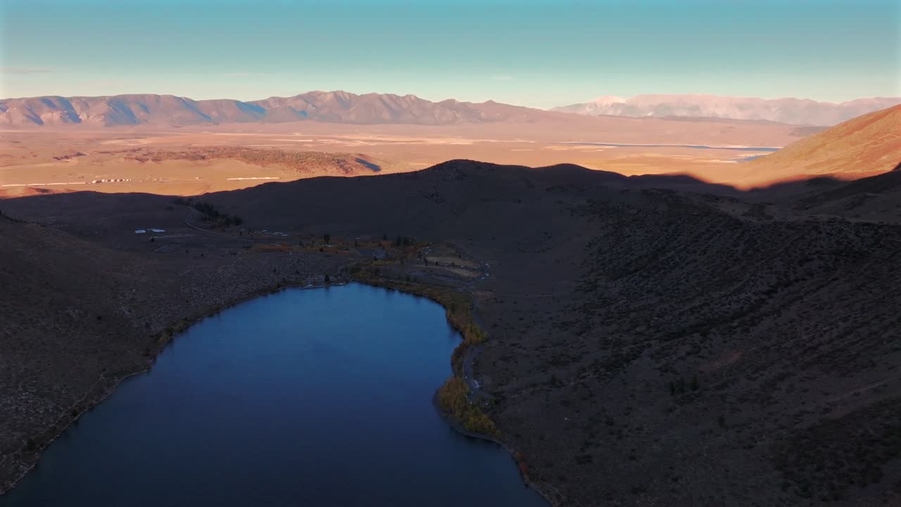 Convict Lake Canyon Trail Mammoth Lakes Mountain Hilltop hot springs aerial drone California autumn fall later afternoon shaded rugged valley peaks Yosemite airport Sierra Nevadas range forward down