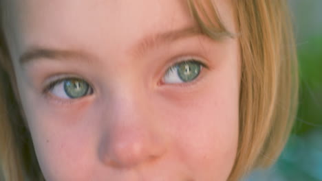 close up portrait of a beautiful little girl with one eye that is both blue and brown