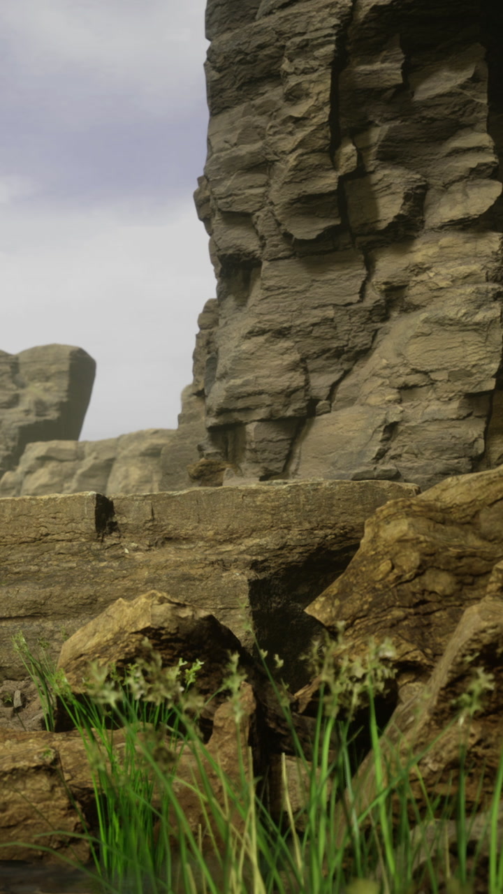 Natures tranquility unfolds by the rocky cliffside with gentle greenery