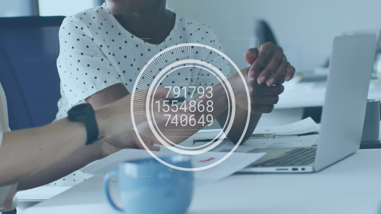 Animation of financial data processing over diverse business people in office