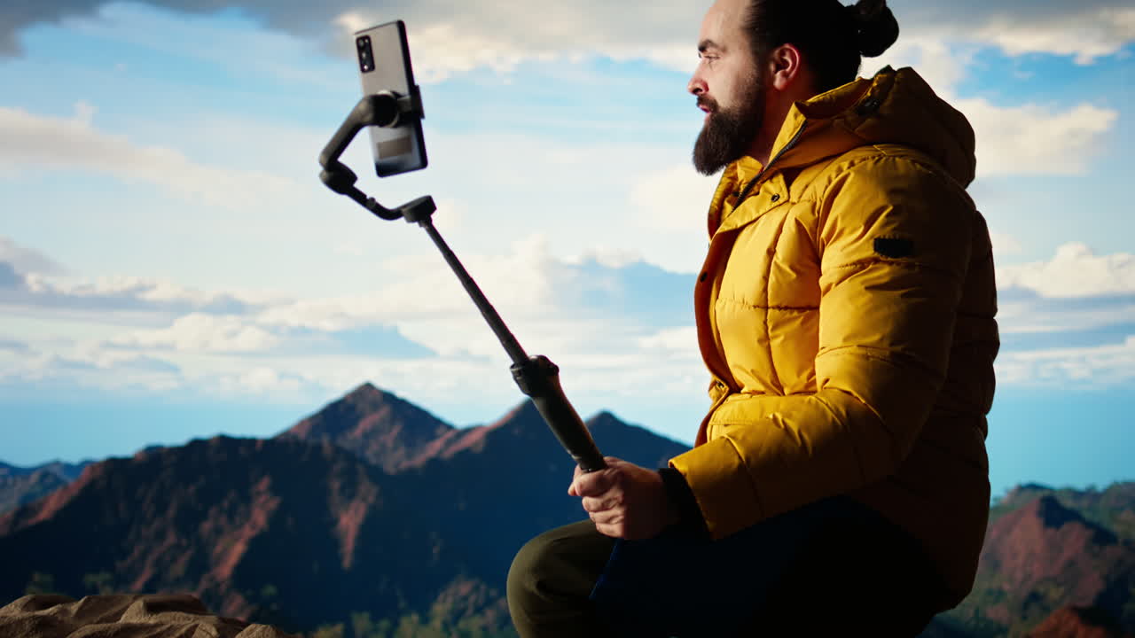 Traveler filming his hiking experience in the wilderness documenting his adventure