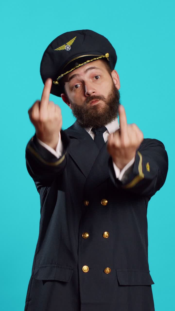 Vertical video: Caucasian airline captain showing middle fingers