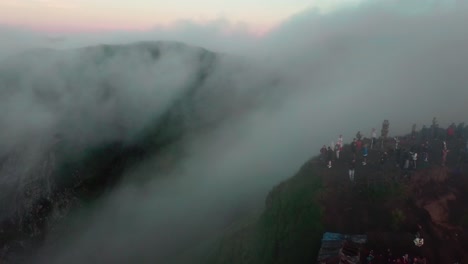 hikers watching a sunrise on top of mount batur