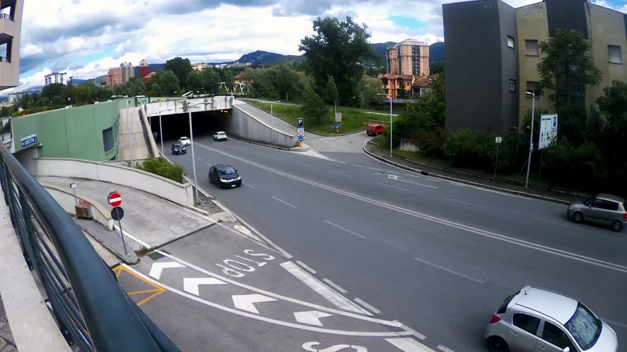 Traffic outside a underpass on a cloudy day