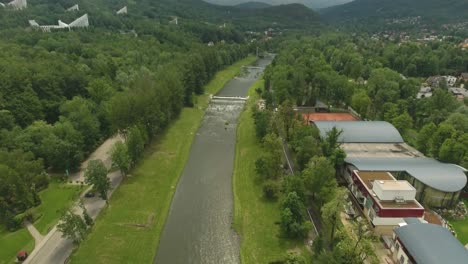 a long and wide river flowing through the center of a tourist town in southern poland