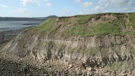 aerial view of north bay, scarborough, north yorkshire with cliffs, coastline, ocean, and castle