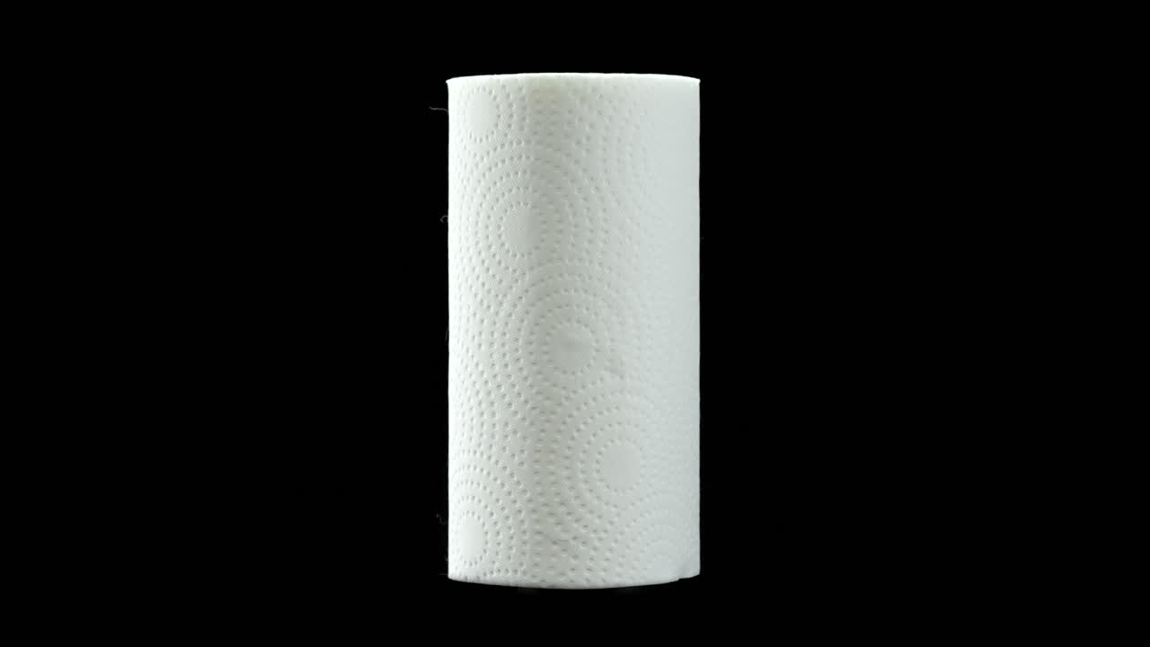 White Paper Towel Roll Isolated on Solid Black Background Studio Shot