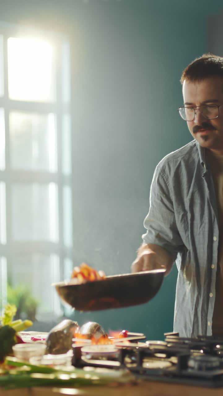 Man cooking with fresh vegetables in the kitchen