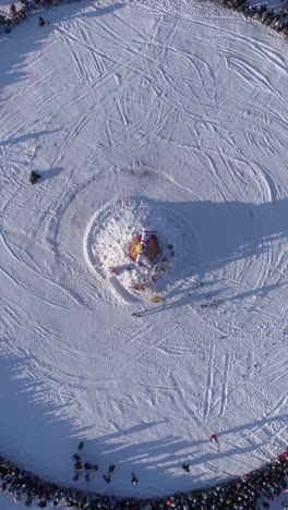 aerial view of winter festivities on a snow-covered slope