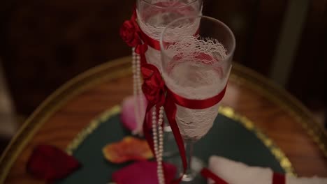 romantic wedding champagne glasses and ring pillow