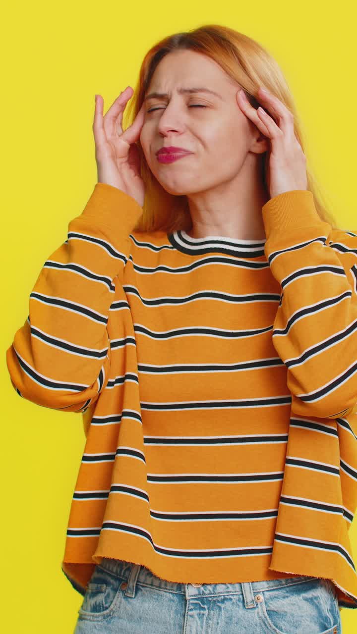 Woman rubbing temples to cure headache problem suffering from tension and migraine stress pain