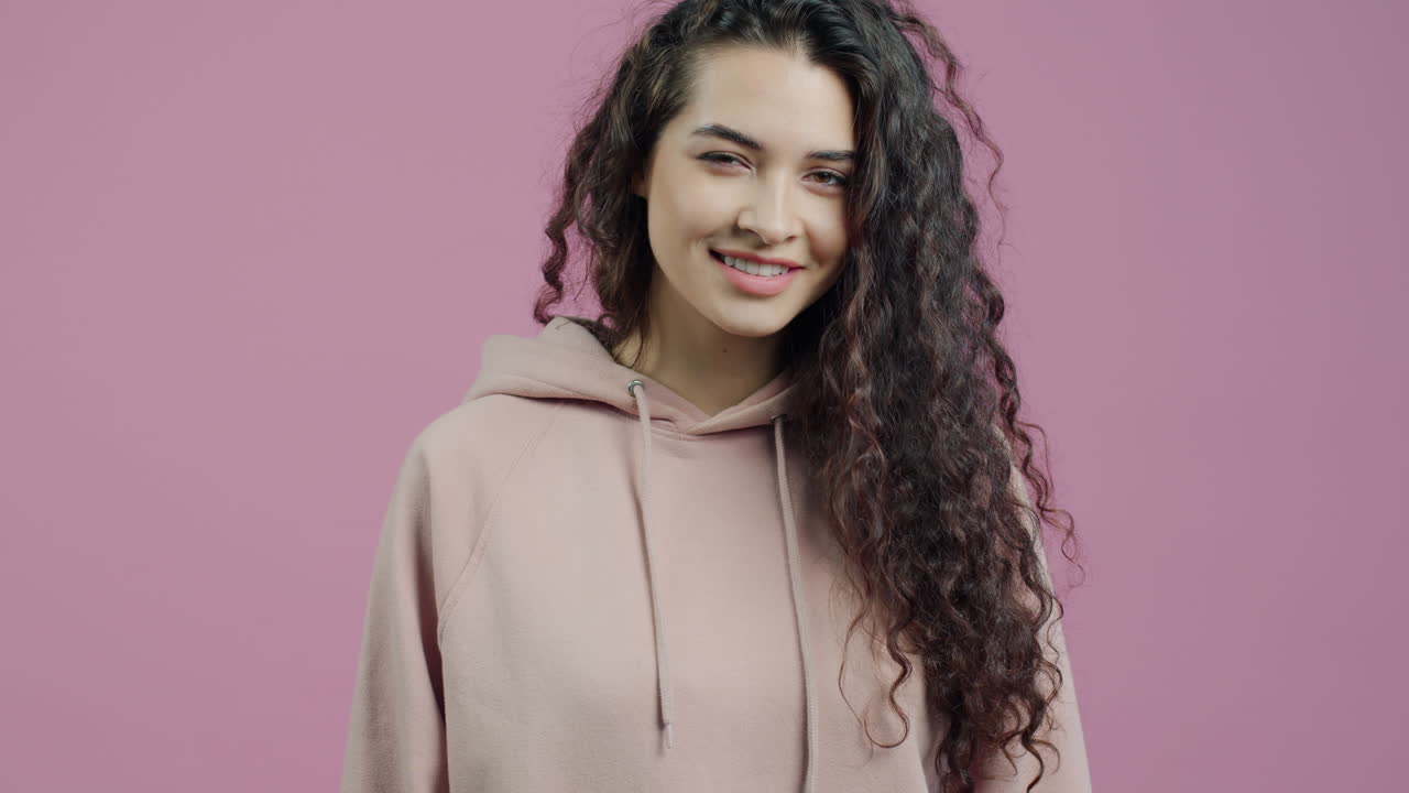 Woman in a Hoodie with Curly Hair