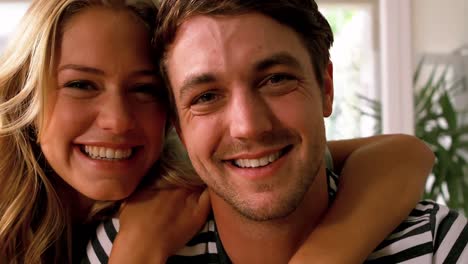smiling couple embracing in the kitchen
