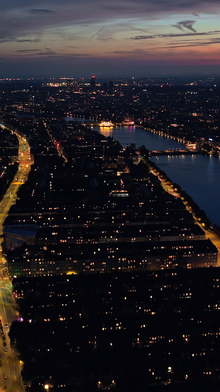 Aerial drone view of the city centre of Copenhagen, Denmark at sunset. Vertical