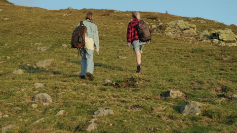 two women hiking in mountains