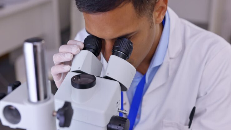 Man, medical science and a microscope