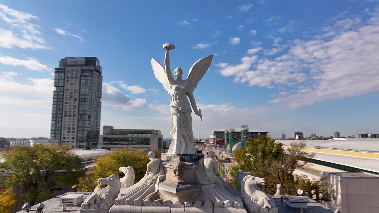 Aerial shot circling the Princes Gates monument with a view of downtown Toronto by the Lake Ontario waterfront