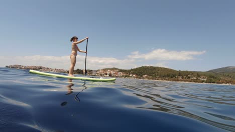 young woman in swimwear doing water sports