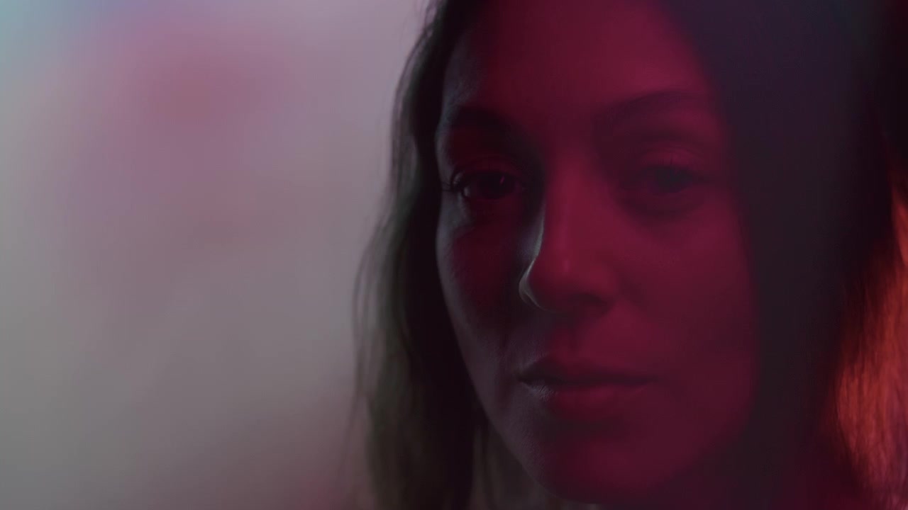 Moody Portrait of Woman with Prism Distortion Effect in Neon Light