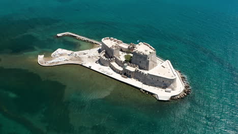 water castle of bourtzi in the middle of the sea in nafplio, greece