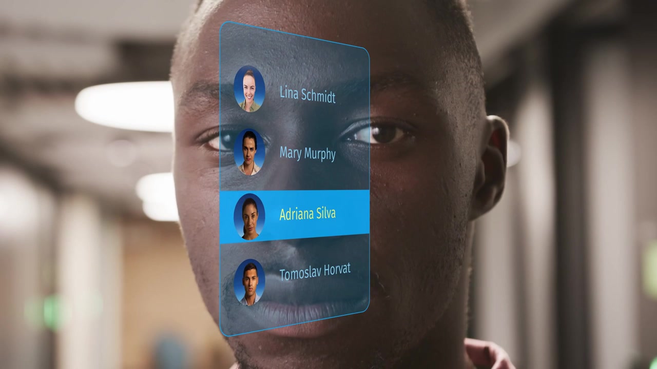 Man shifting gaze in corridor, translucent contact menu appearing and cycling avatars for tech demo