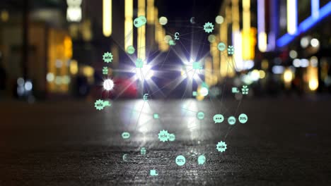 Animation-of-globe-of-digital-icons-spinning-against-blurred-view-of-night-city-traffic