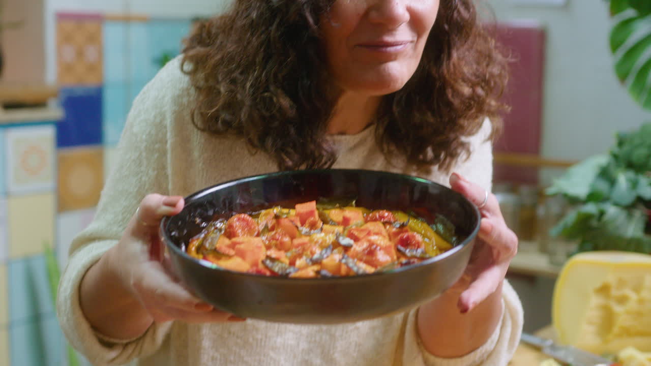 Woman holding a bowl of homemade food