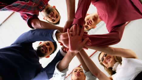 group of business people forming a hand stack