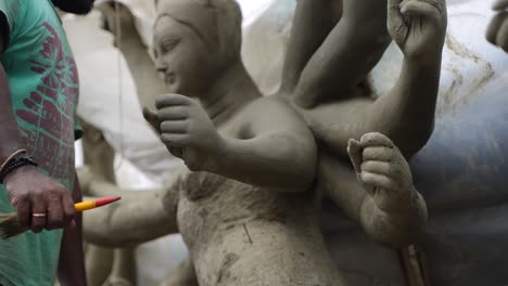 in kumortuli, idol artists are making idols of durga, the revered deity of hinduism. the work of making these idols starts from june and these potters make many idols till november.