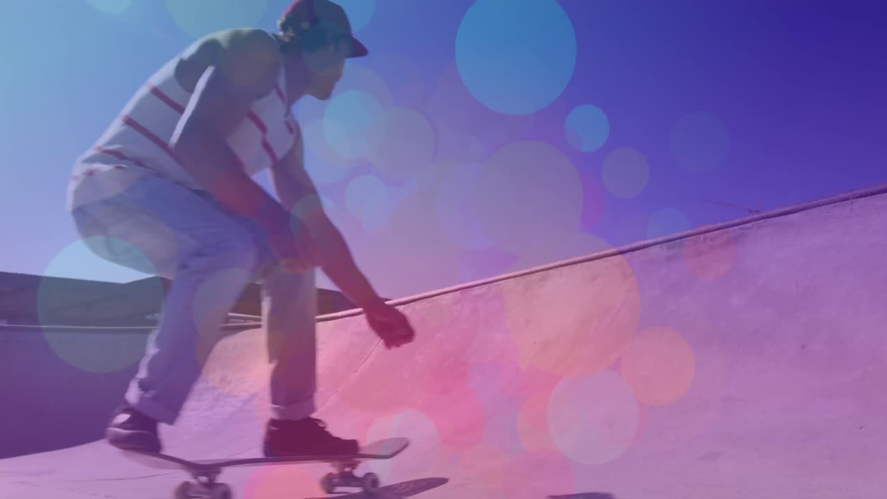 animación de puntos coloridos sobre el hombre caucásico patinando