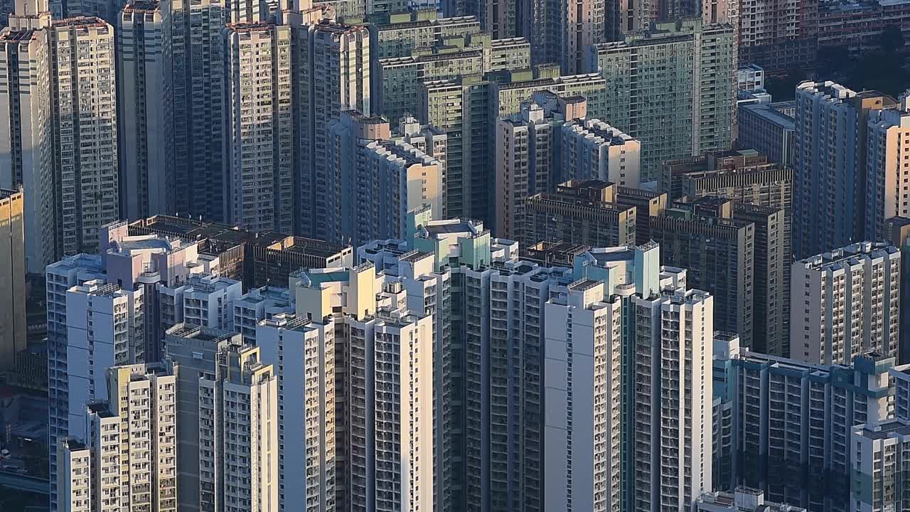 Overlooking the dense apartment buildings in Kowloon, Hong Kong, this aerial urban view captures the incredible city density and vertical architecture that define the city’s landscape
