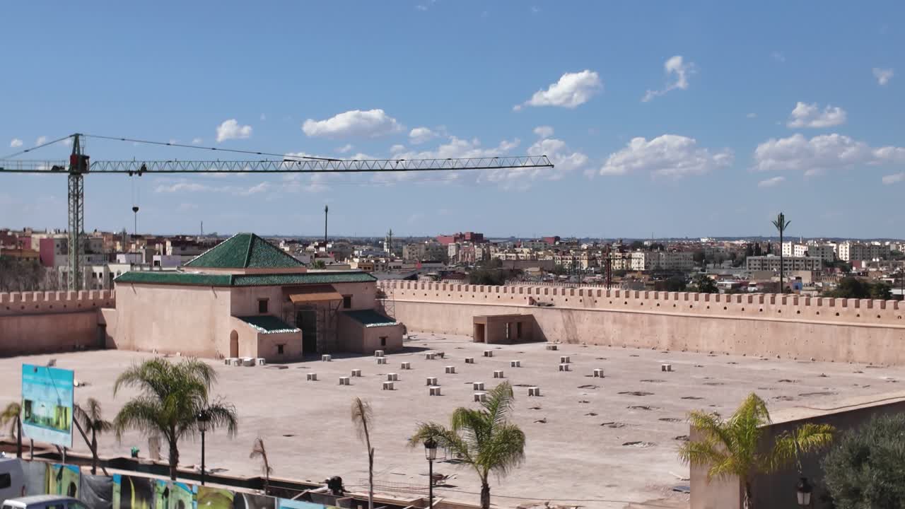 Wide shot of Qara Prison in Meknes, Morocco, featuring a construction crane, highlighting urban development and historical preservation