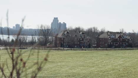 Farm-fields-with-a-beautiful-view-of-the-Ottawa-river-valley,-apartment-buildings-and-high-rise-condos-in-the-distance-in-Gatineau,-Quebec