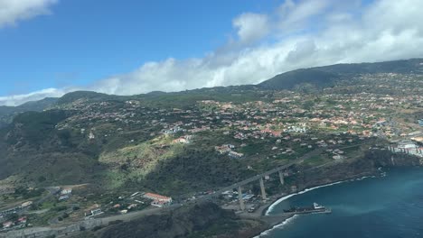 aerial view of the southern coast of madeira island during a real time approach to funchal airport