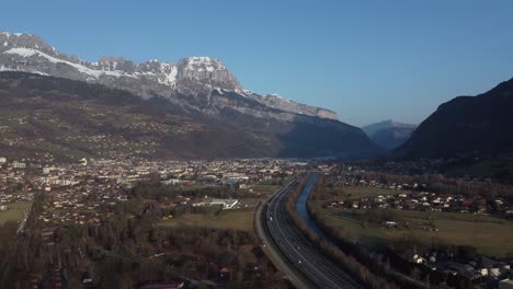 Bird's-eye-view-of-the-A40,-also-known-as-the-white-highway-in-France,-which-runs-past-the-famous-ski-resorts-of-Chamonix,-Saint-Gervais-or-Megève