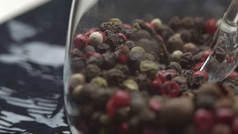 black peppercorns are kept in glassware