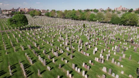 Rows-of-tombstones-in-lush-green-garden-cemetery