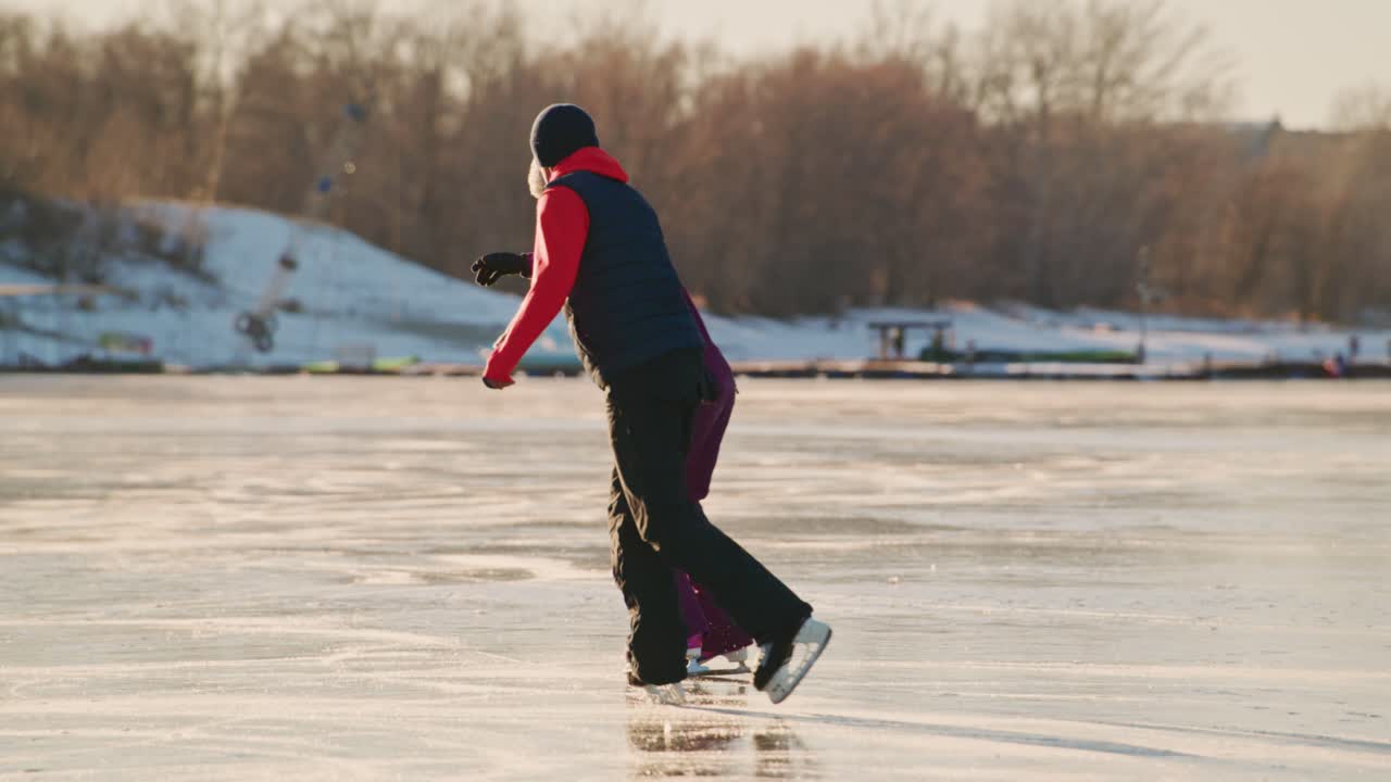 Couple Ice Skating on a Frozen Lake