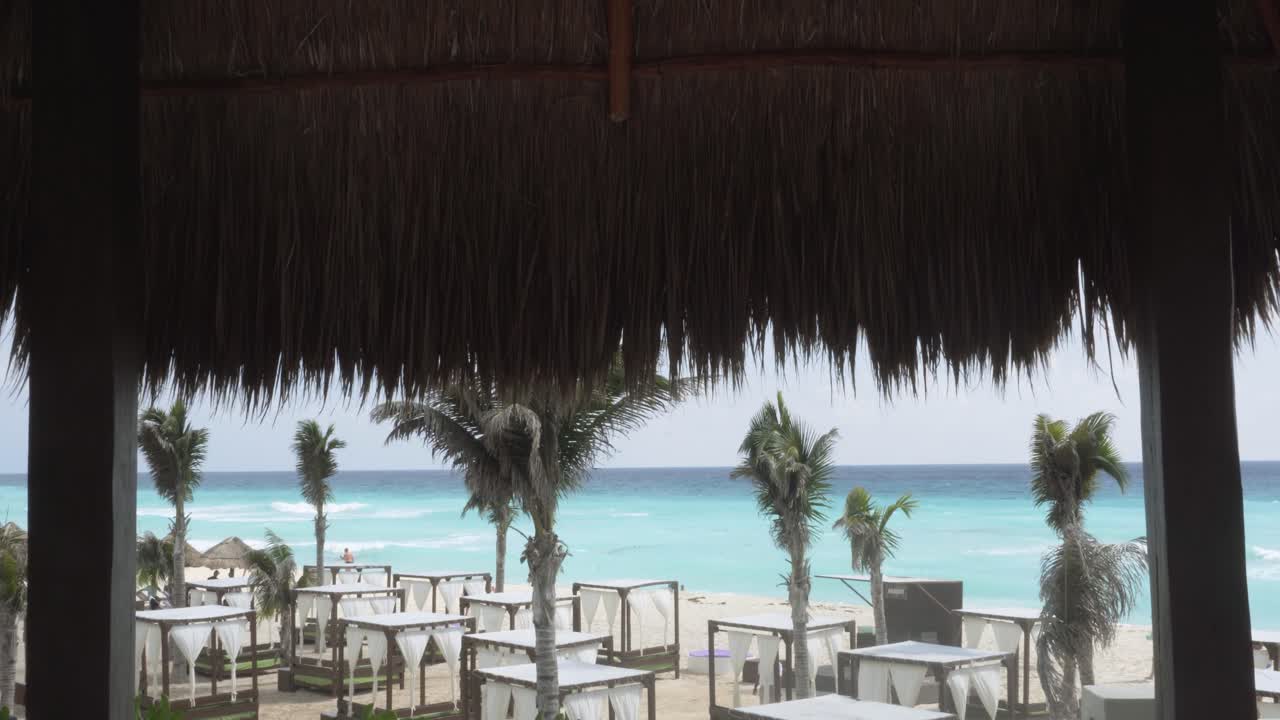 View of the Caribbean beach from a Hut. Luxury Resort Hotel.