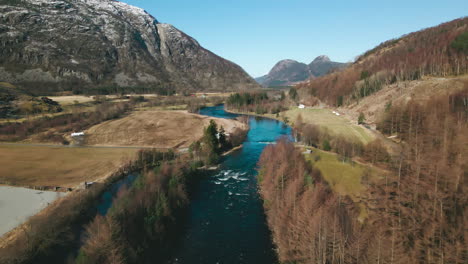 drone flight up ardals river in picturesque rural countryside, norway